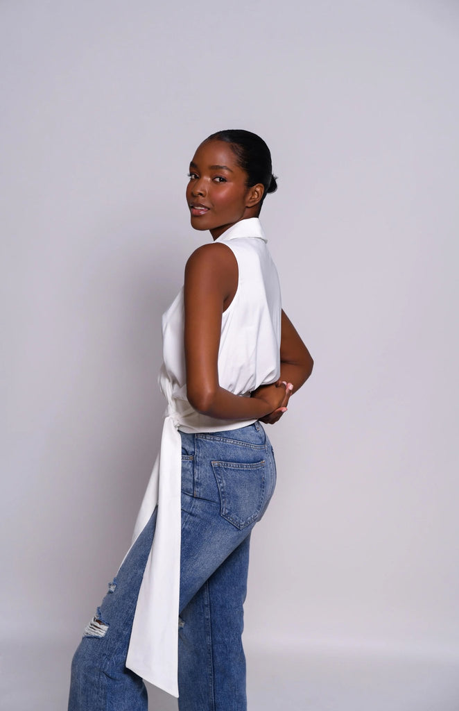 Model wearing the Hutch valen top in white with side tie detail.
