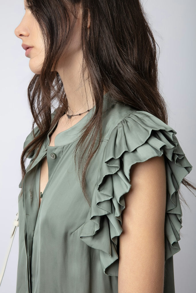 Up close image of the zadig and voltaire tiza satin top in treillis ruffle detail on shoulder