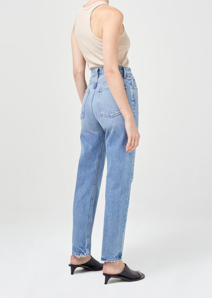 agolde pinch waist in abstract denim on model behind view