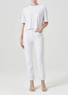 agolde women's riley high rise straight crop denim in sour cream. Model is wearing monochromatic outfit.