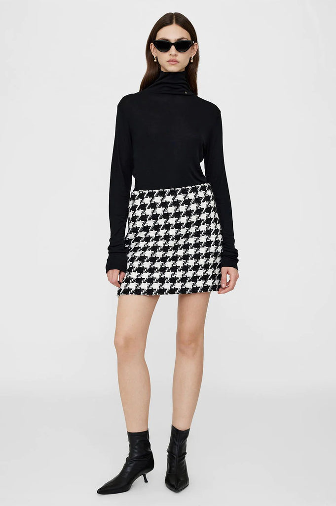 anine bing ada skirt in black and white houndstooth on model