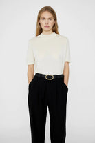 anine bing signature link belt in black women women's belt gold hardware on model