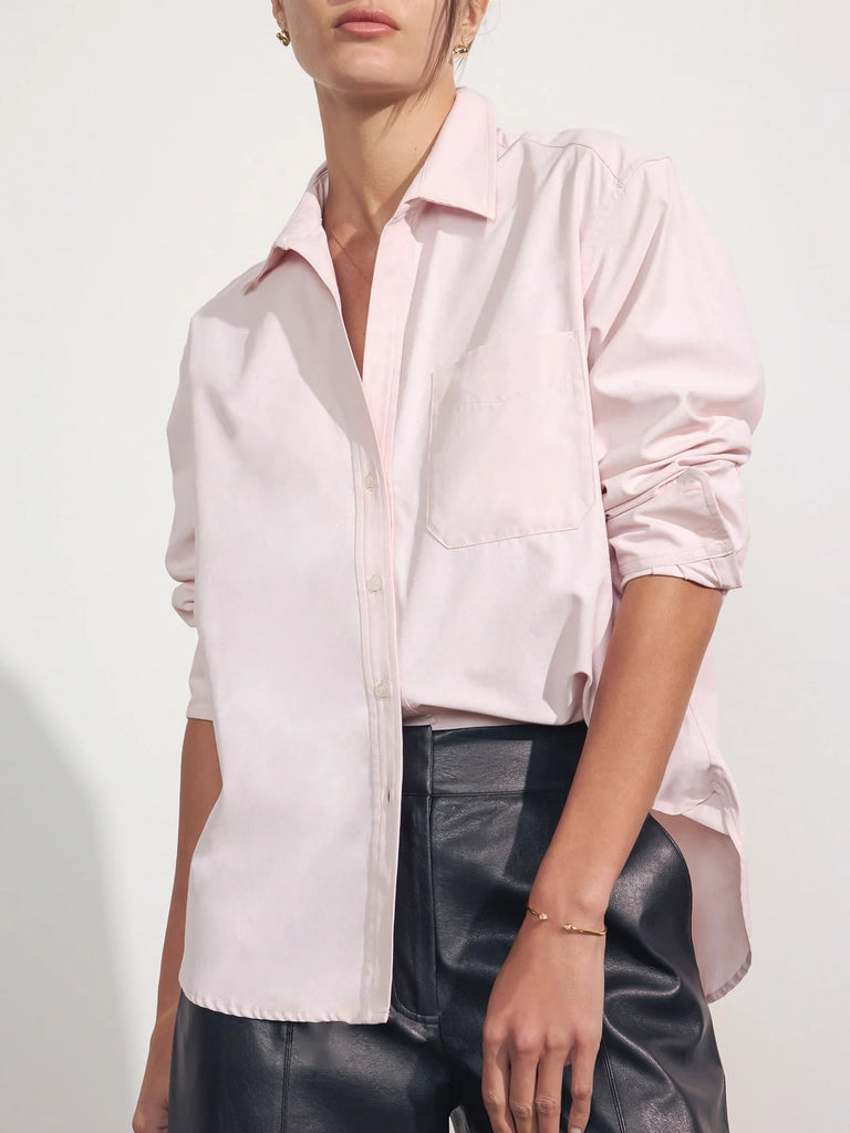 Brochu Walker The Everyday shirt in rose quartz. Light pink women's button down worn on model with black leather pants.