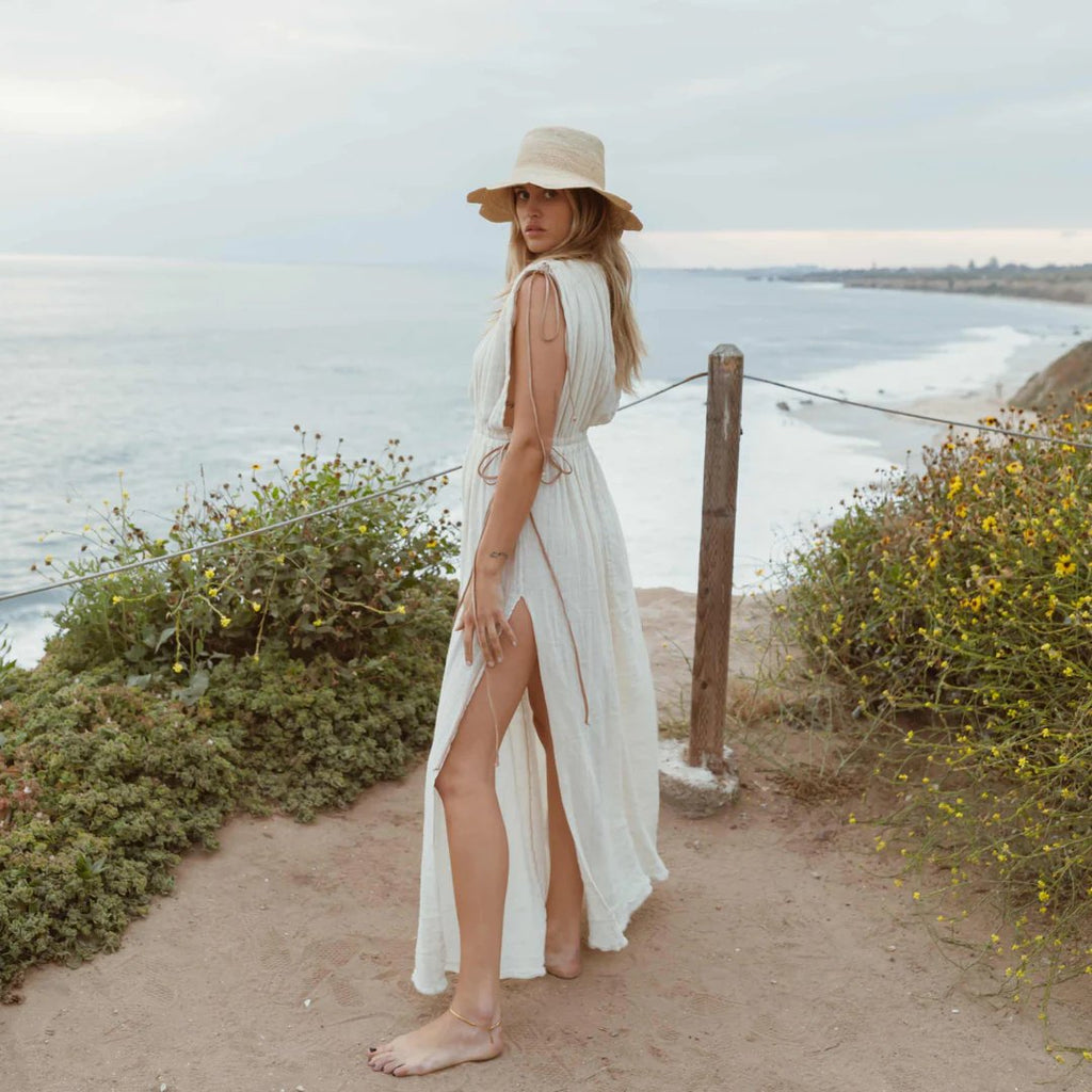 freya packable scallop crochet bucket hat in natural styled on model at the beach