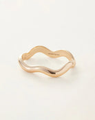 Jenny Bird Ola bangle in high polish gold. Curved gold bangle with a hinge and tab lock closure.