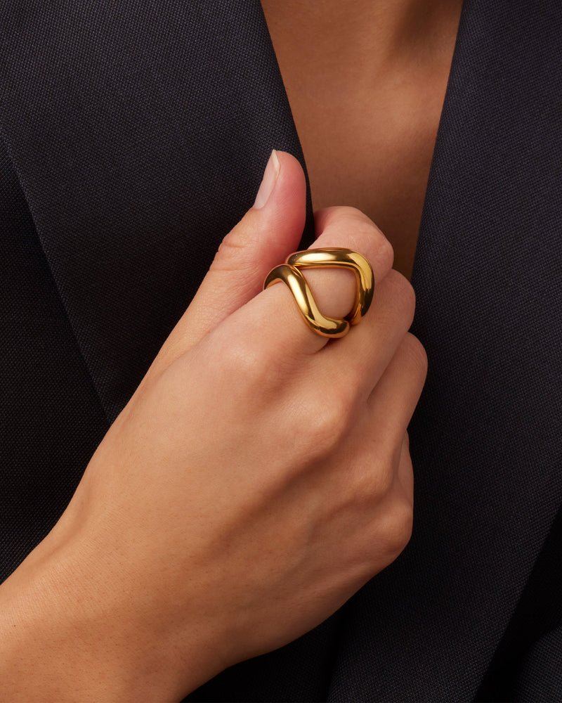 Jenny Bird ola ring set in high polish gold. Set of two rings styled on model wearing blazer.