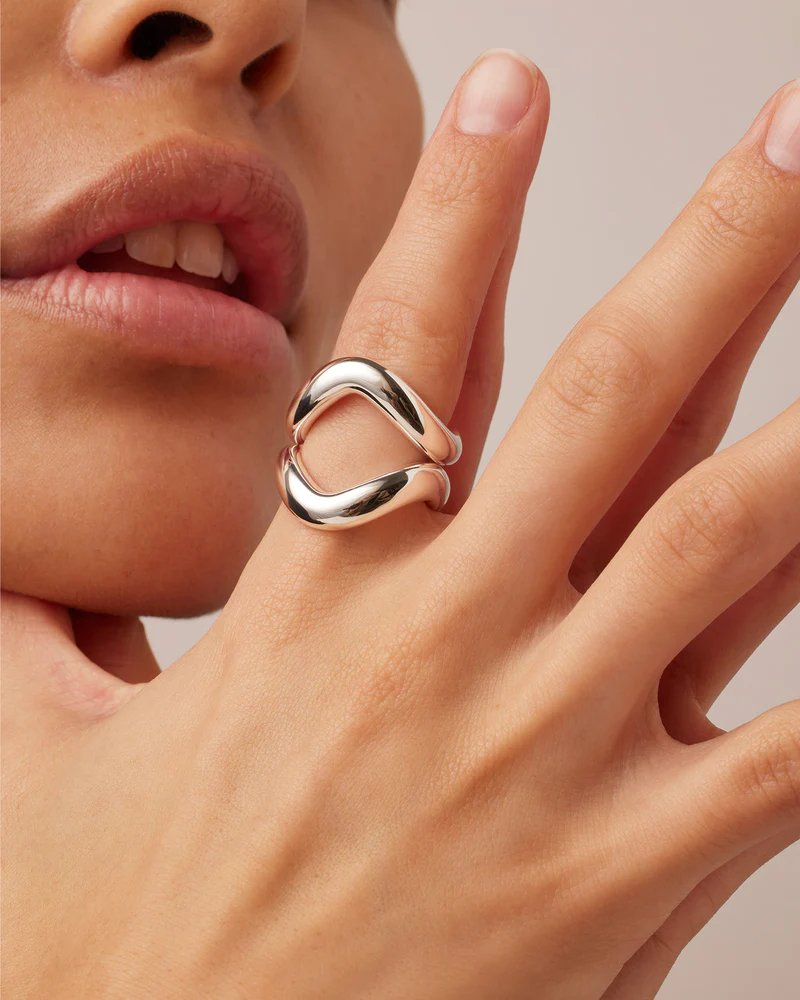 Jenny Bird's ola ring set in high polish silver. A dynamic, tubular ring set. Image includes two rings on model's finger.