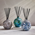 three lafco absolute diffusers in hand-blown glass vessels