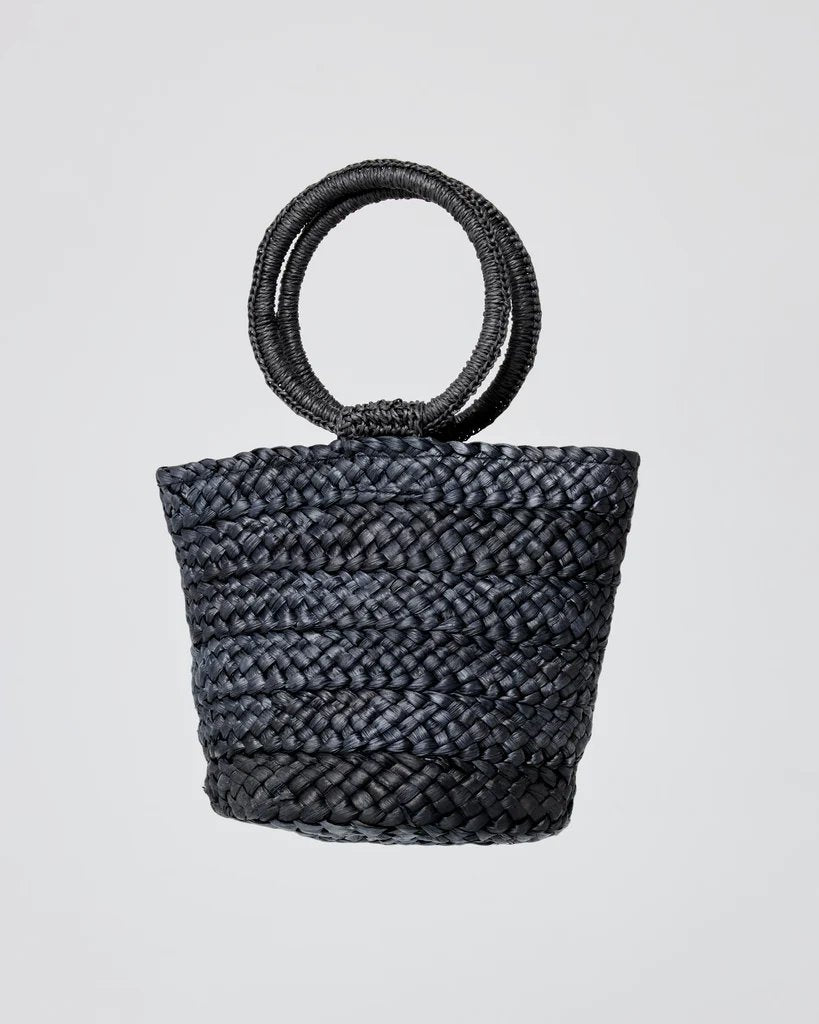 lspace bella bag in black woven with metal closure and fun circular handle