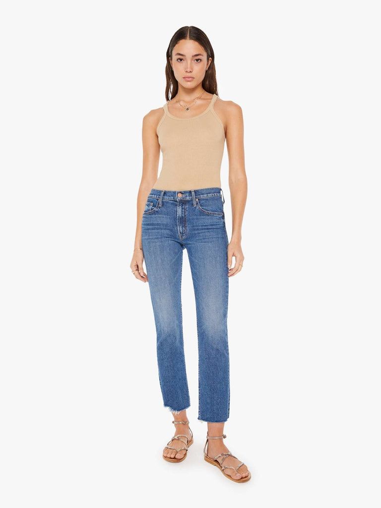 mother denim the mid rise rider ankle fray in local charm medium wash jeans on model