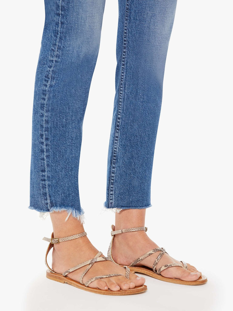 mother denim the mid rise rider ankle fray in local charm medium wash jeans on model up close image of bottom hem