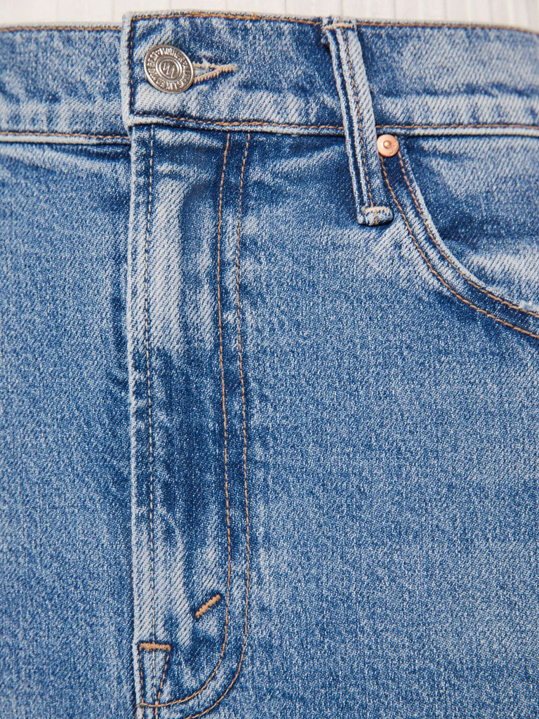 Detail image of stitching and buckle of mother the split second denim skirt in strike a pose.