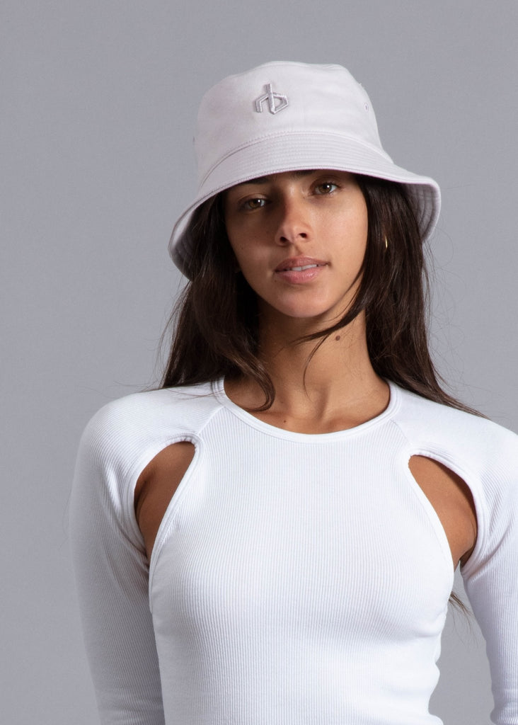 rag and bone aron bucket hat in pure white styled on model