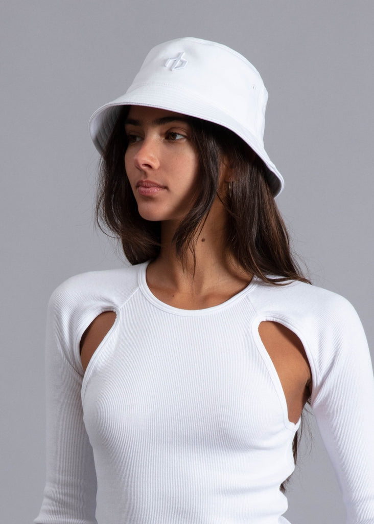 rag and bone aron bucket hat in pure white styled on model in all white outfit